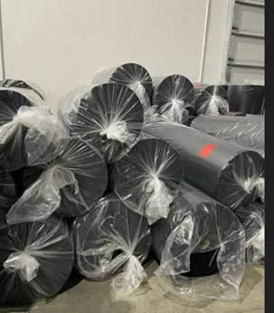 Automotive carpet stocklot rolls wrapped for export in warehouse